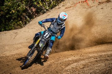  Rider tearing up the track, kicking up some roost!